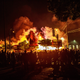 Protesters gather around a liquor store in flames near the Third Police Precinct on May 28, 2020 in Minneapolis, Minnesota, during a protest over the death of George Floyd,